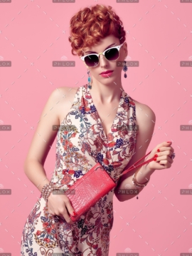 demo-attachment-685-fashion-redhead-model-in-summer-jumpsuit-on-pink-PXX3EL8